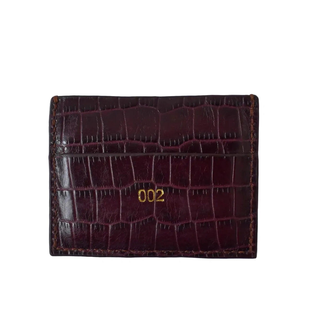 Burgundy crocodile-patterned wallet with '002' on a white background