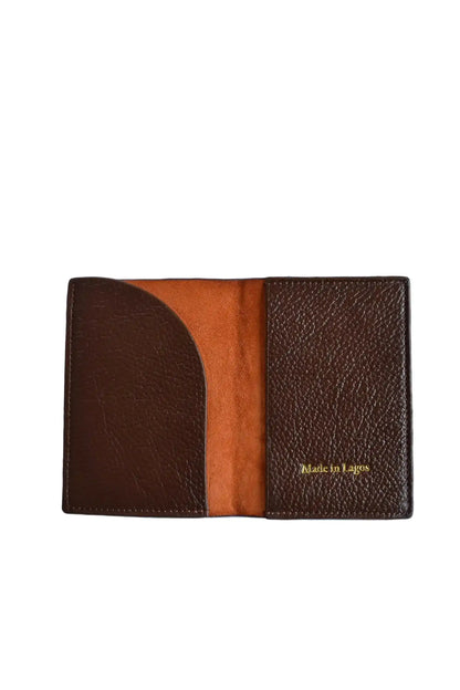 Brown leather wallet with 'Made in Lagos' text on a white background
