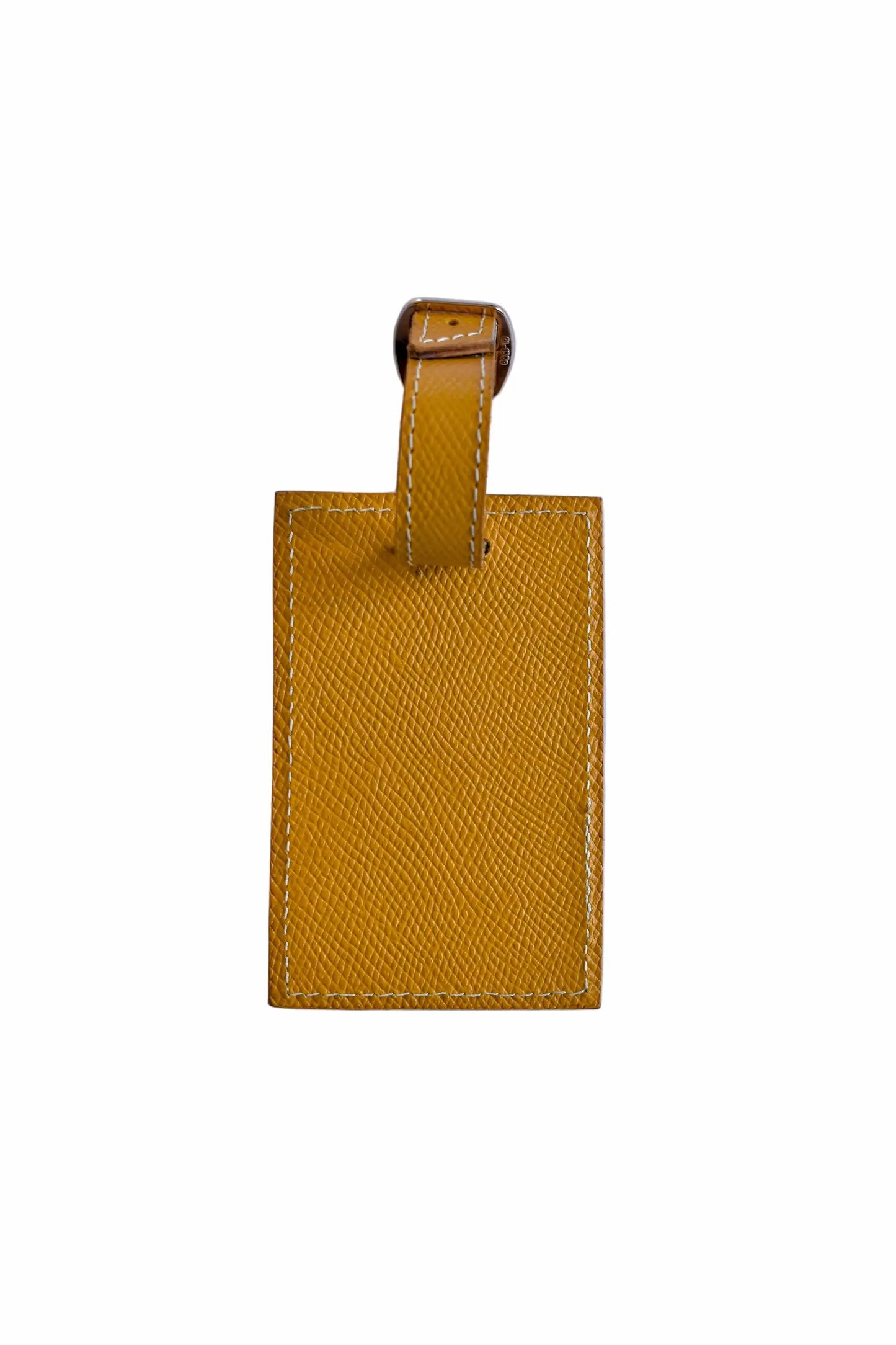 Yellow leather luggage tag on a white background