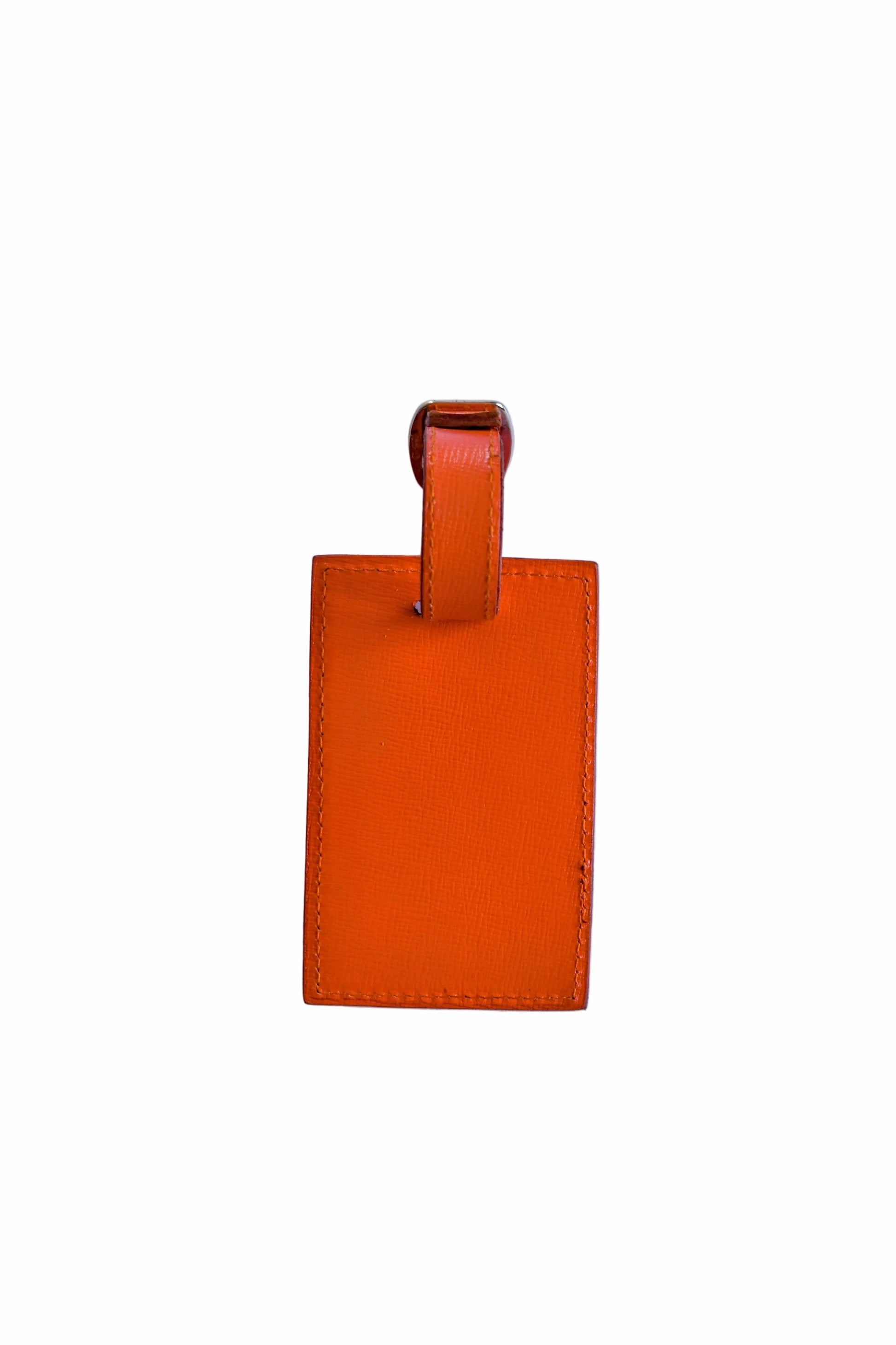 Orange leather luggage tag on a white background