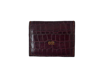 Burgundy crocodile-patterned wallet with '002' on a white background